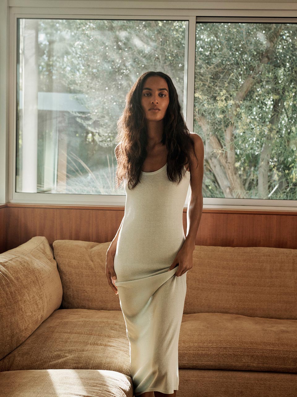 Model posing in a green dress