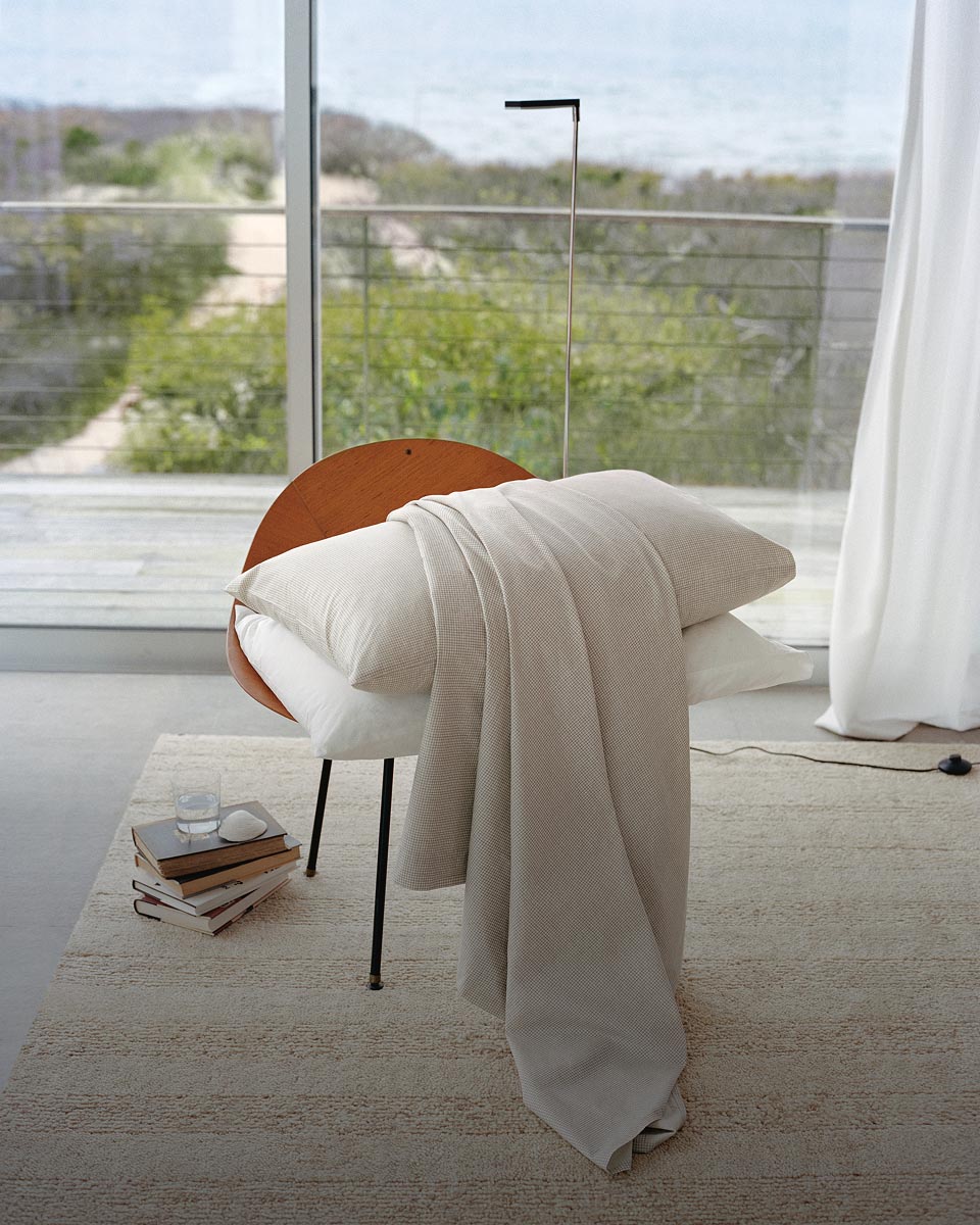 Still life image of a sham on a chair