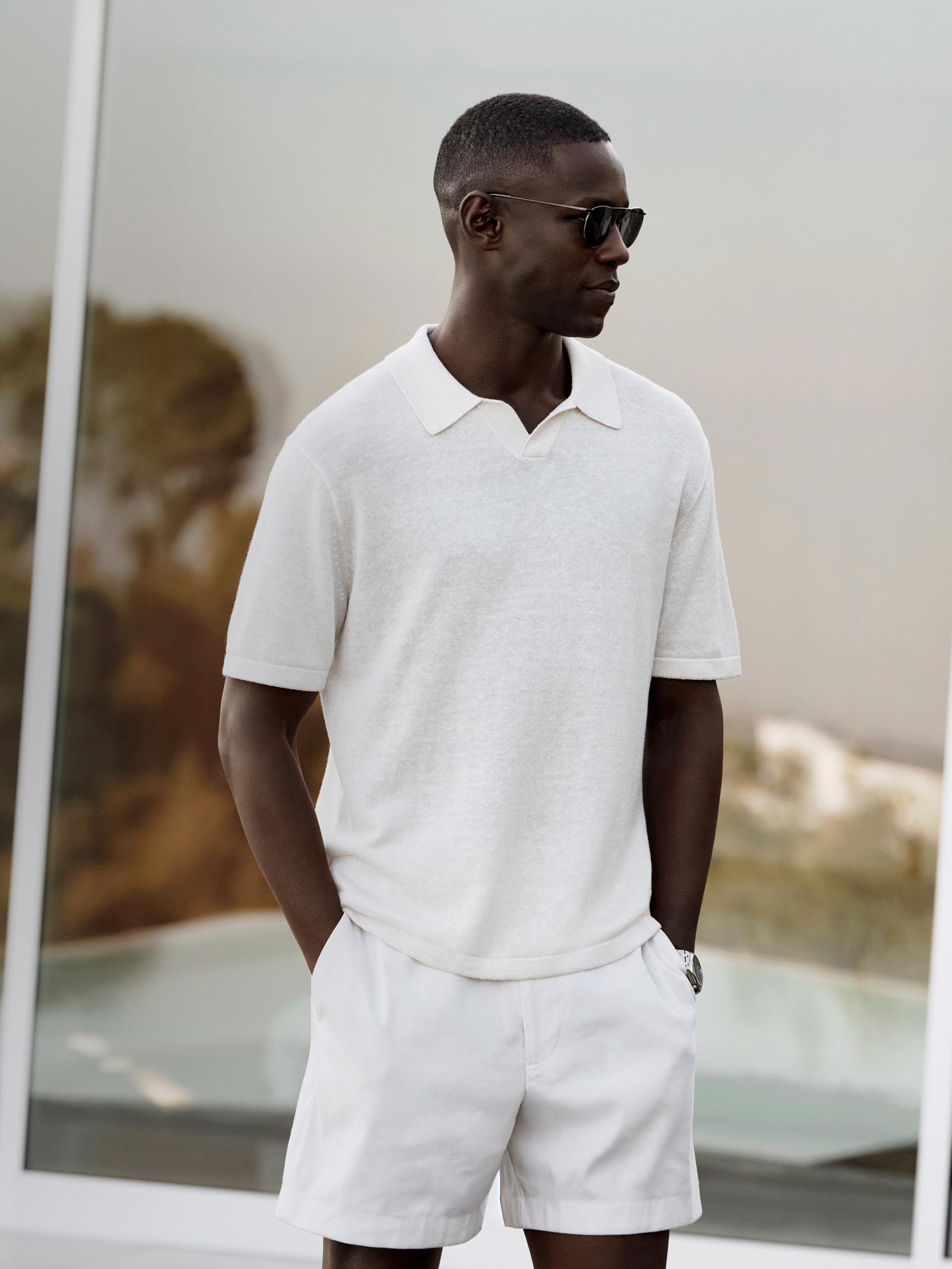 Models posing in Calvin Klein linen apparel