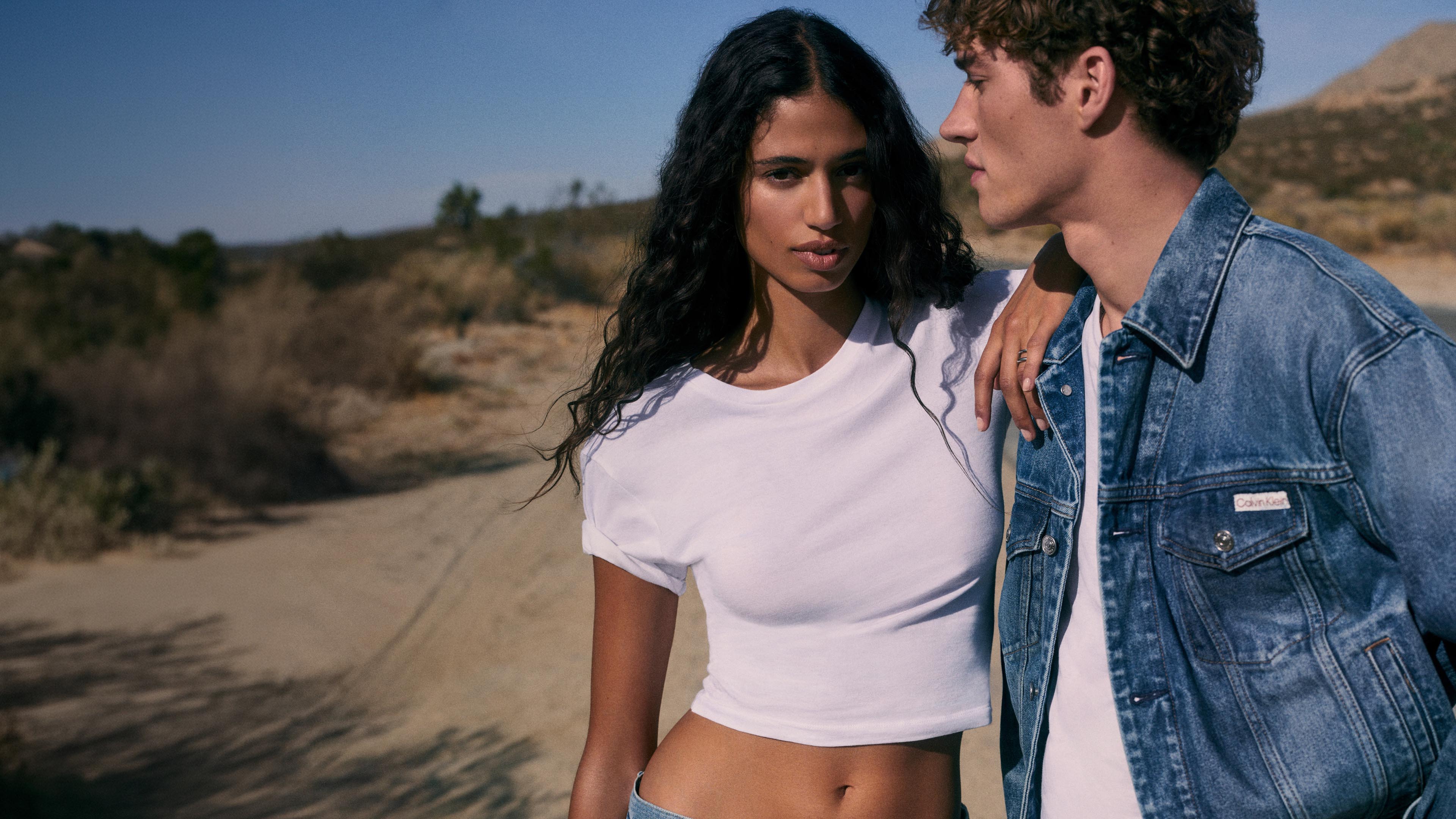 Models posing in Calvin Klein tees