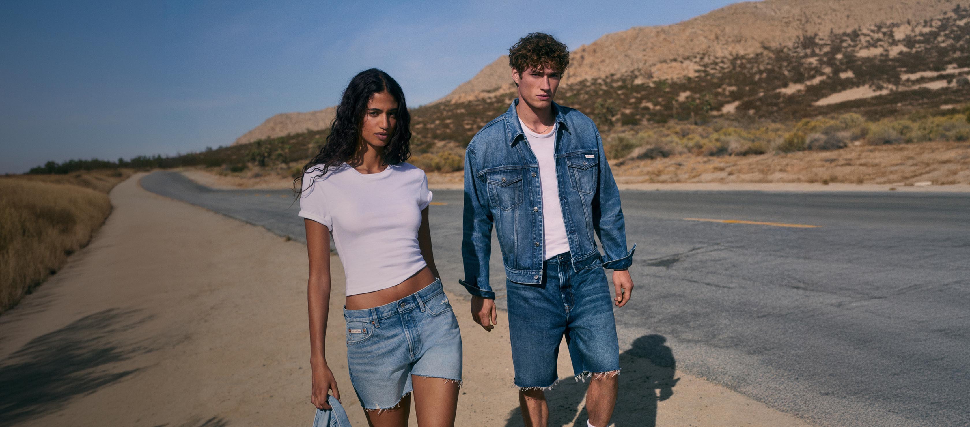 Models posing in Calvin Klein jeans and underwear