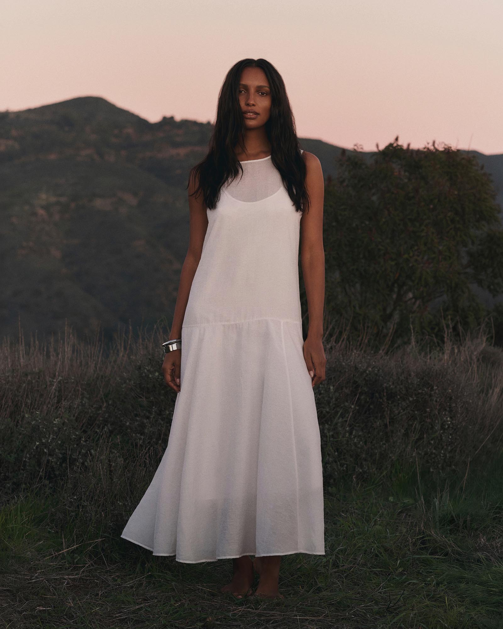 Model posing in a white dress