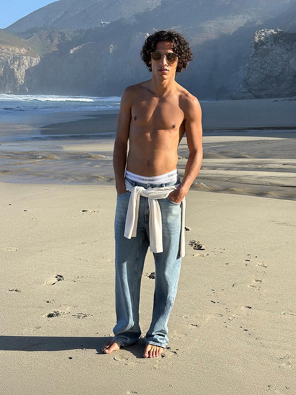 Model posing in 90s straight jeans