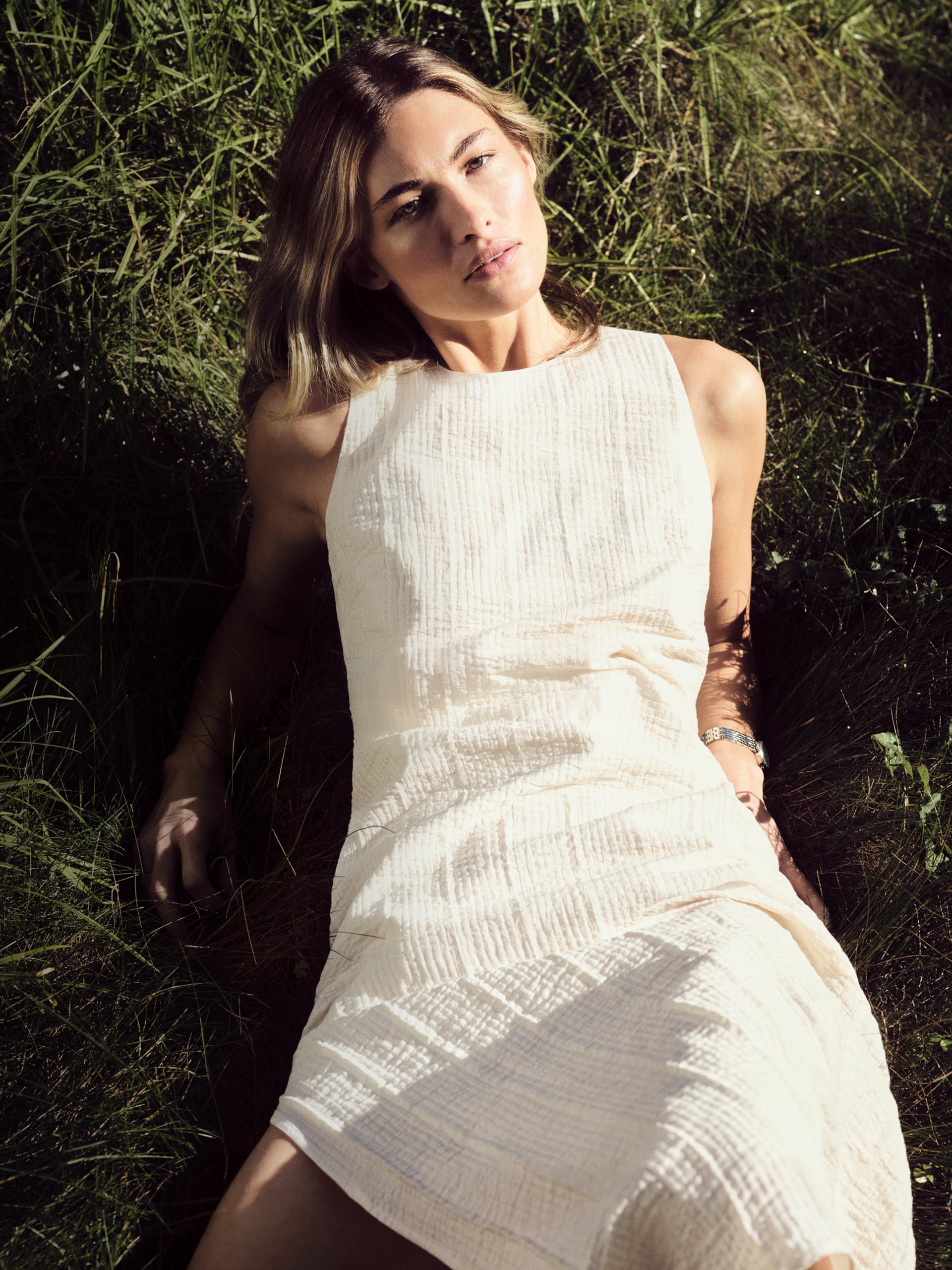Model posing in a Calvin Klein dress