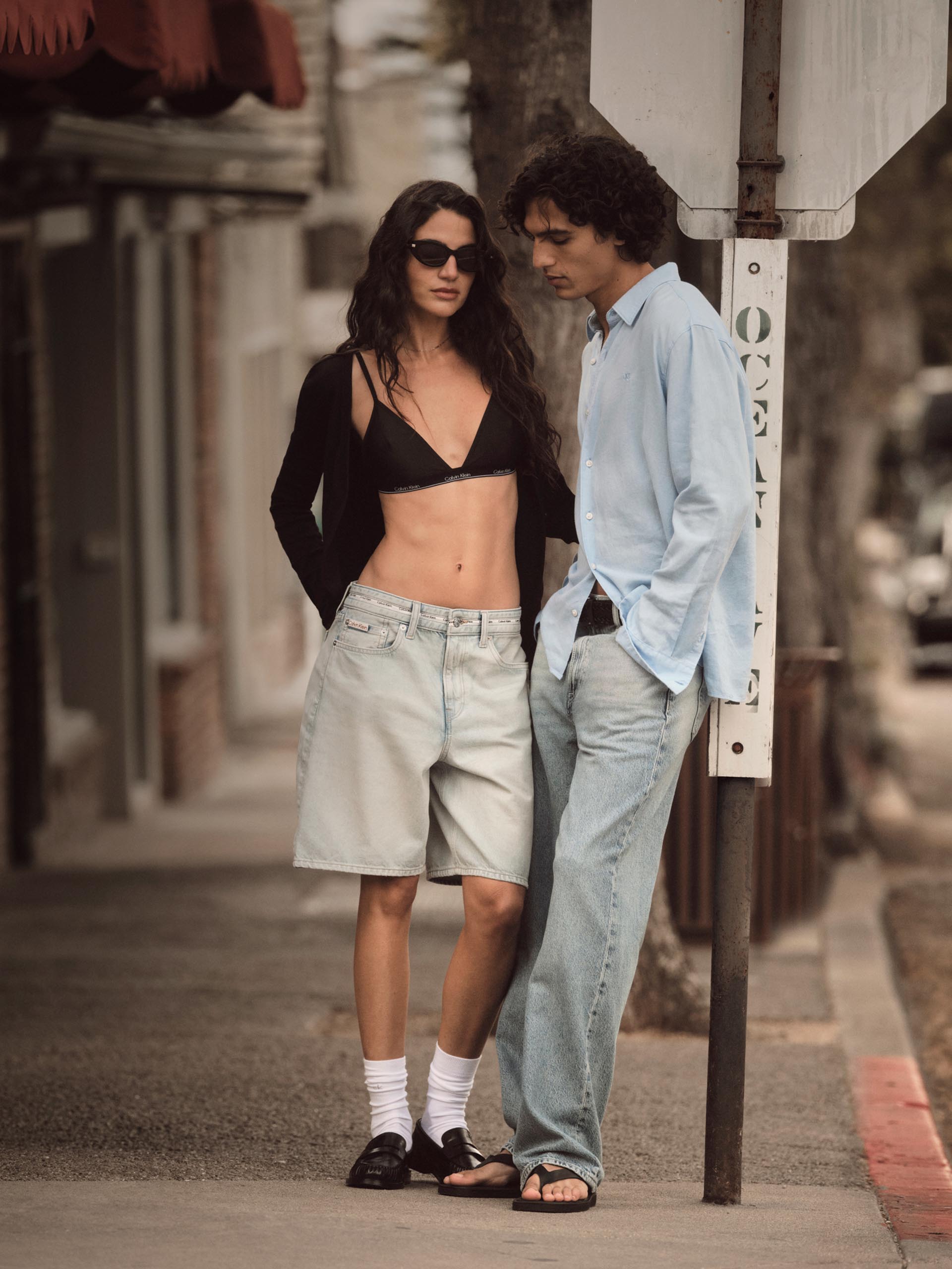 Models posing in Calvin Klein summer apparel