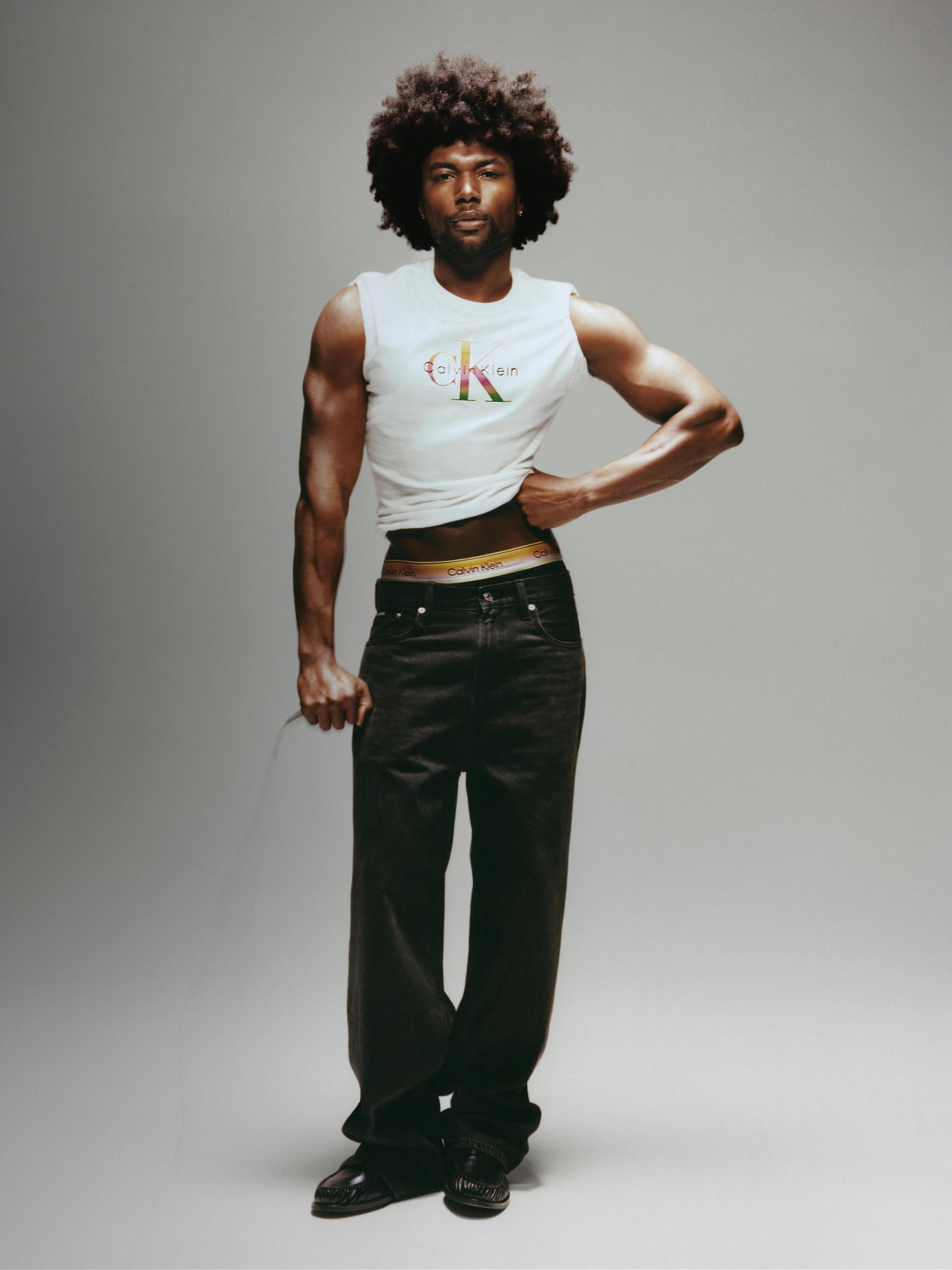 Models posing in Calvin Klein Pride underwear and apparel