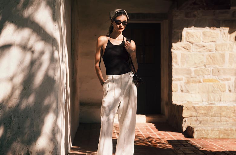 Model posing in Calvin Klein linen apparel 