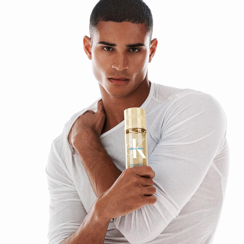 Model posing with a new Calvin Klein Body Mist