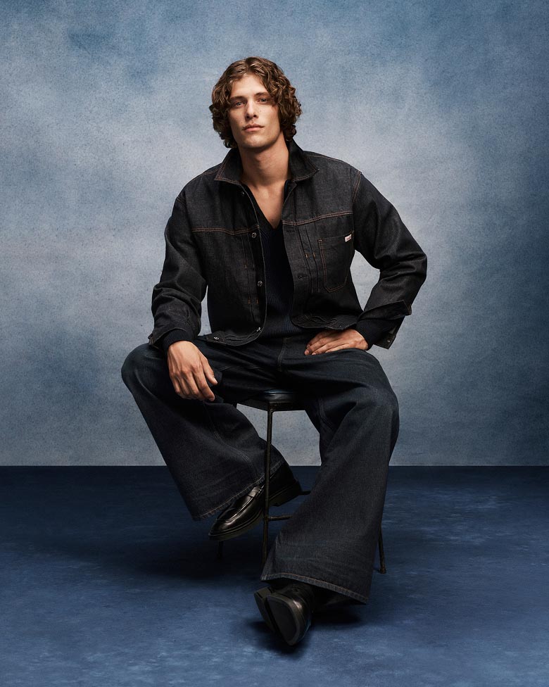 Model posing in the Pleated Trucker Jacket