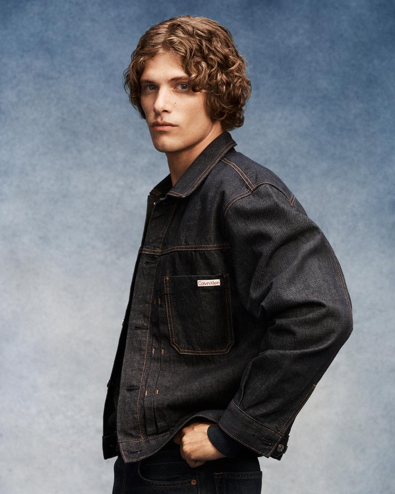Model posing in the Pleated Trucker Jacket