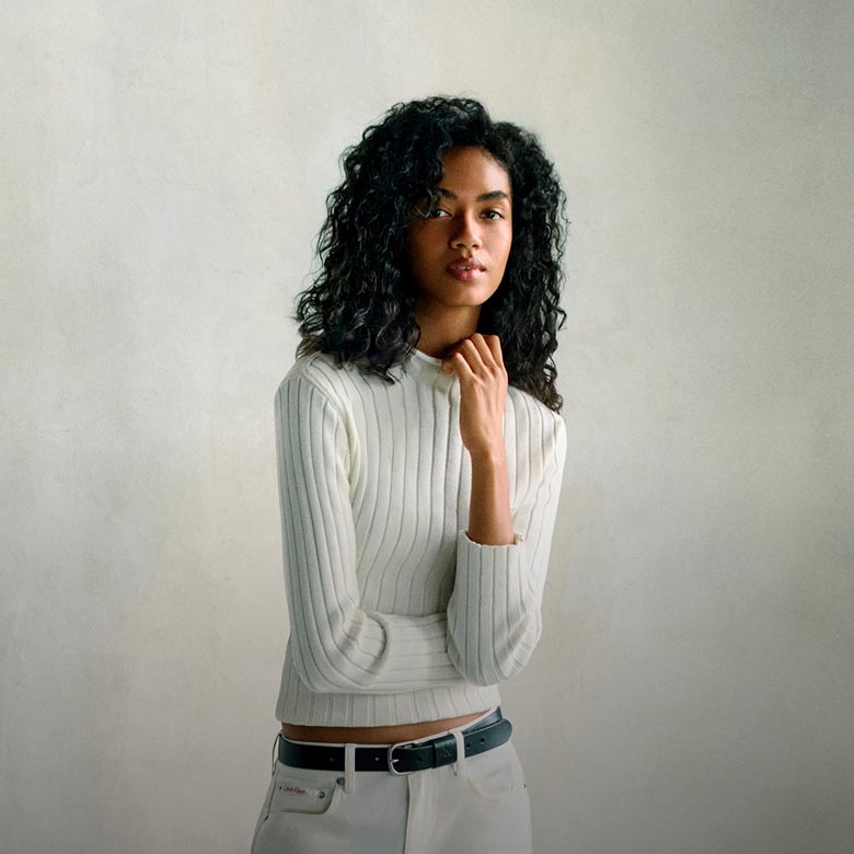 Model posing in transitional apparel