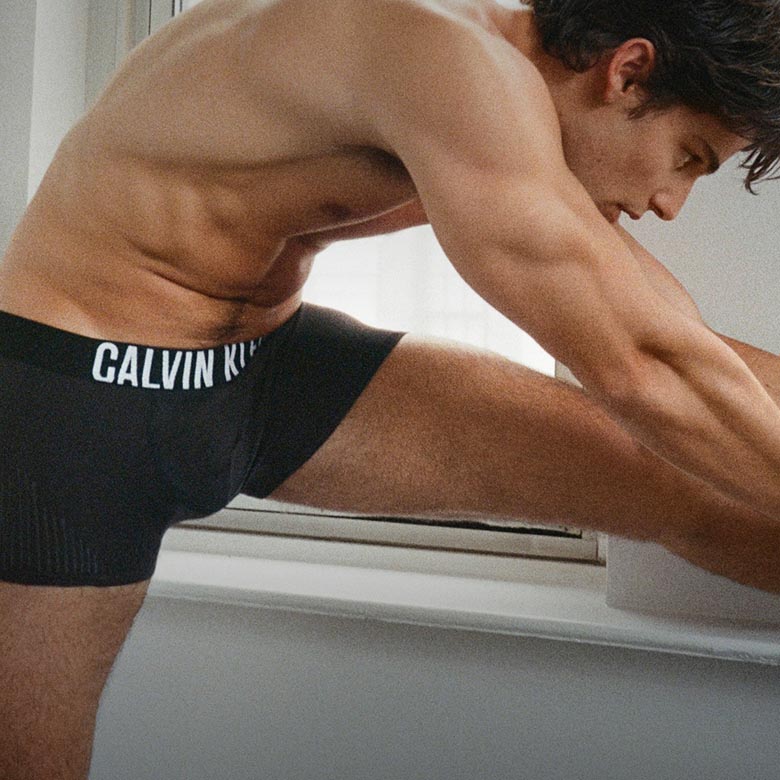 Model posing in black Intense Power trunk underwear