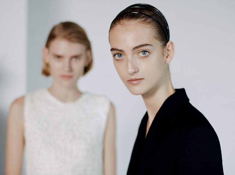 Two models backstage at the runway show