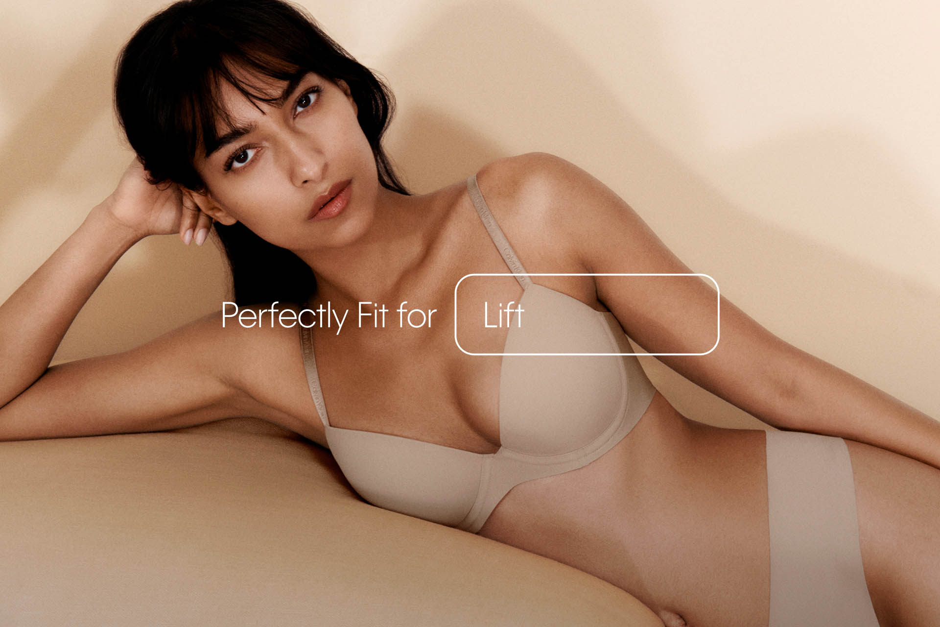 A model posing in a black Perfectly Fit Triangle bra