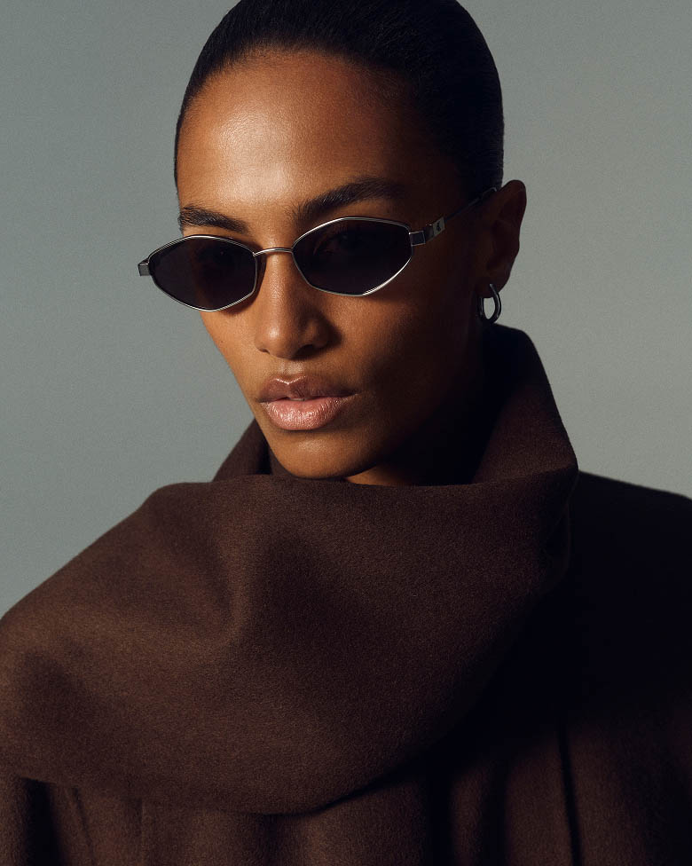Model posing in rectangle sunglasses