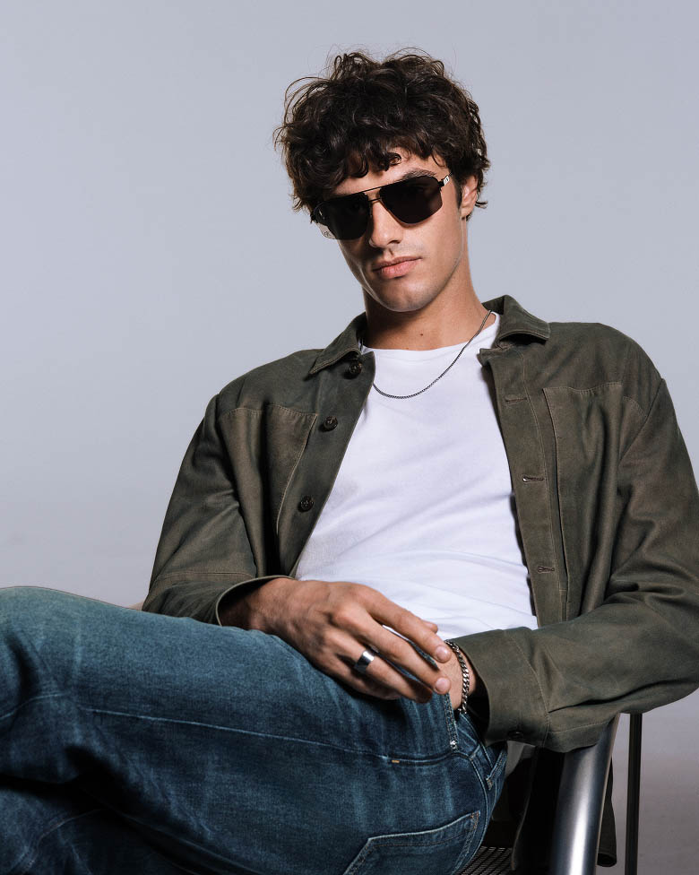 Model posing in rectangle sunglasses