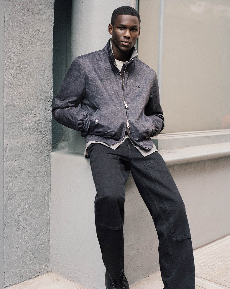 Model posing in a printed denim jacket