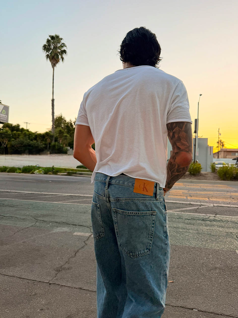Evan Fong posing in baggy jeans