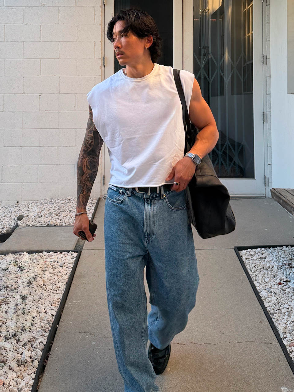 Evan Fong posing in baggy jeans