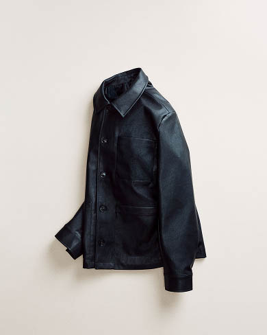 Still life image of a black leather jacket