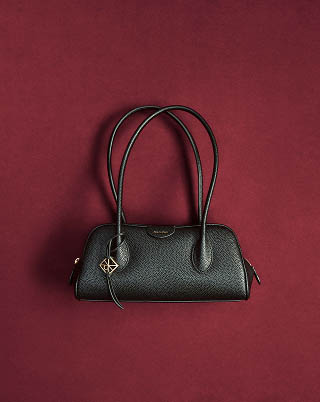 Still life image of a black handbag