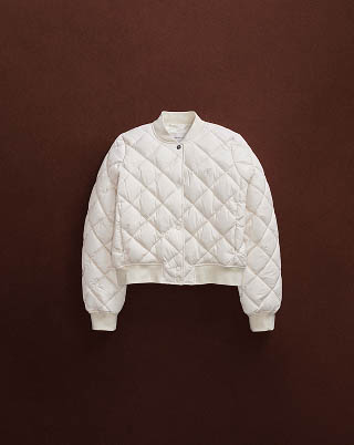 Still life image of a white puffer jacket