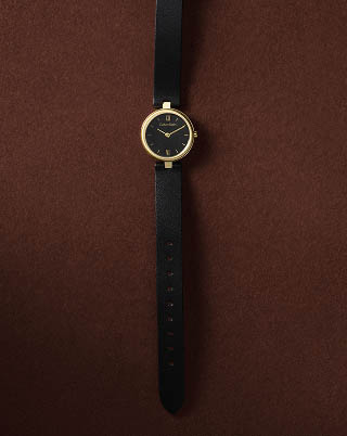 Still life image of a black strap watch