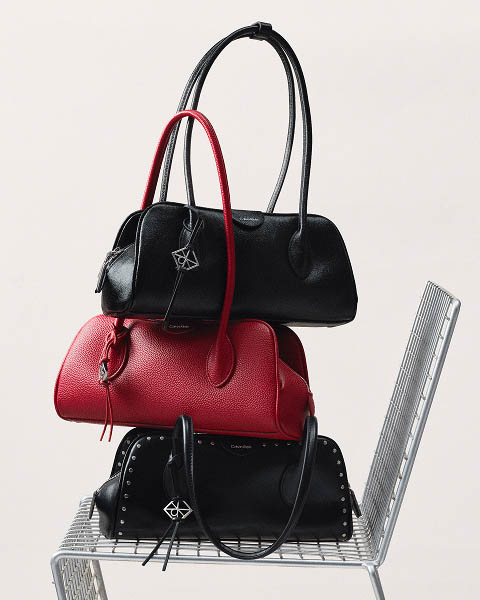 Still life image of a stack of handbags