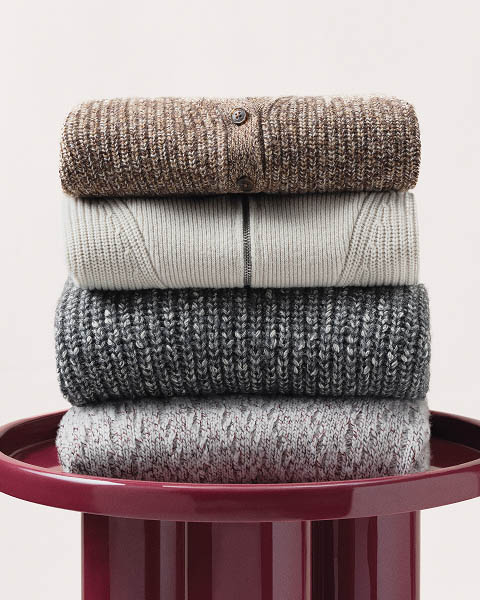 Still life image of a stack of sweaters