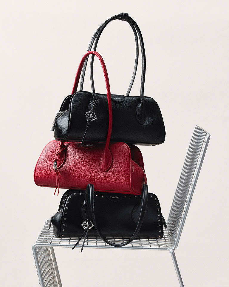 Still life image of a stack of handbags
