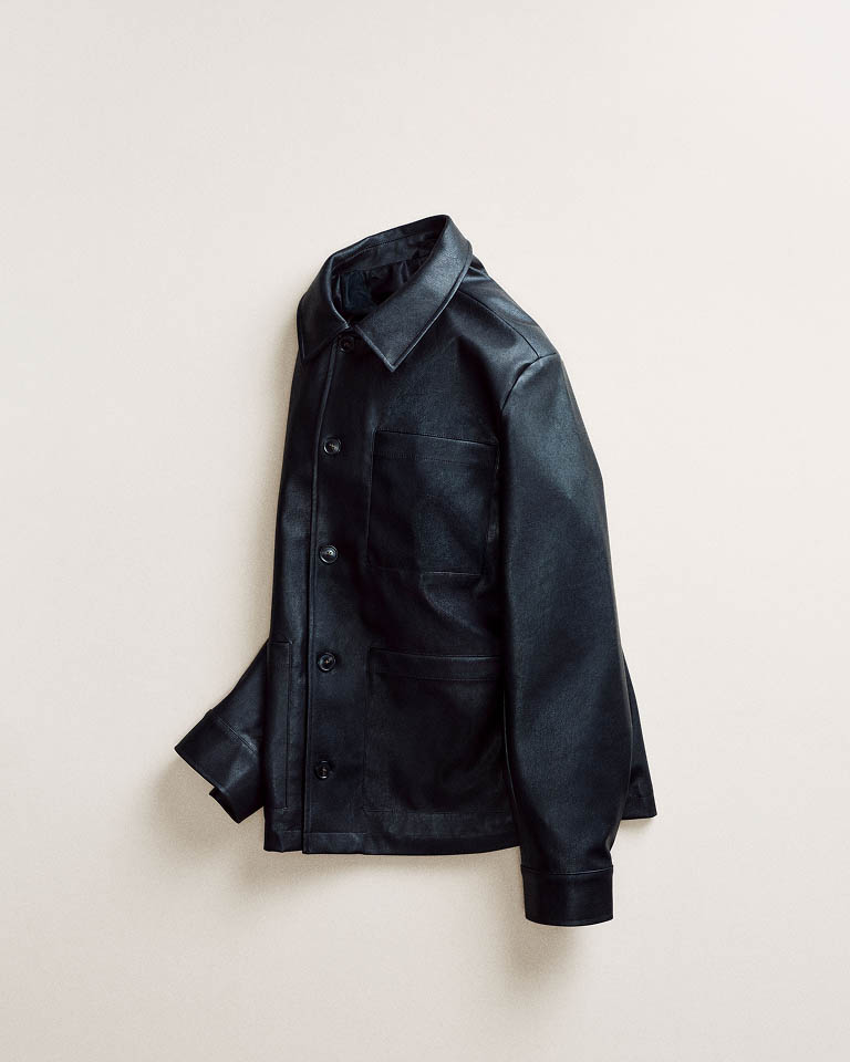 Still life image of a black puffer jacket