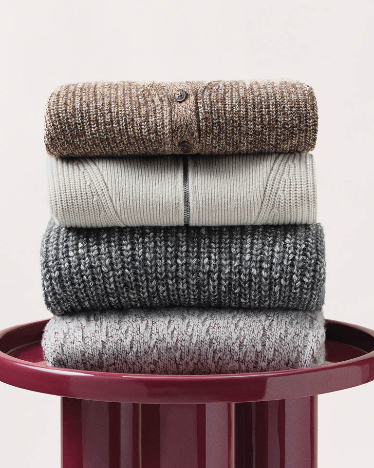 Still life image of a stack of sweaters