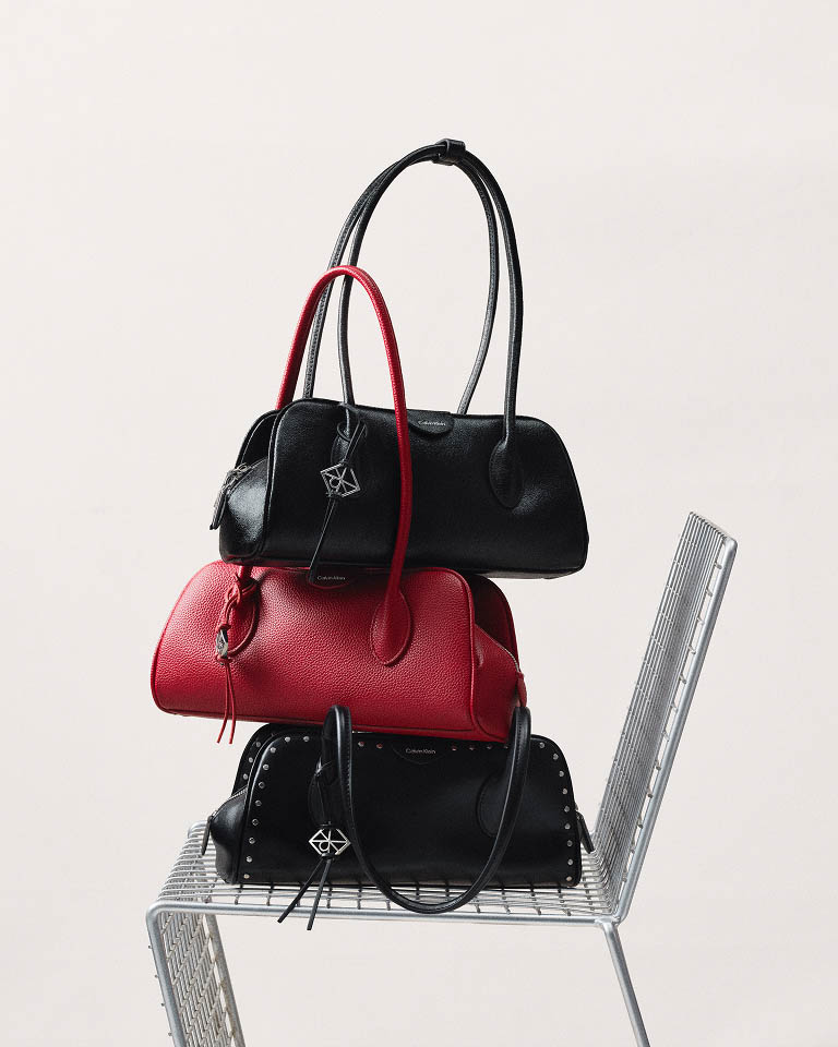 Still life image of a stack of handbags